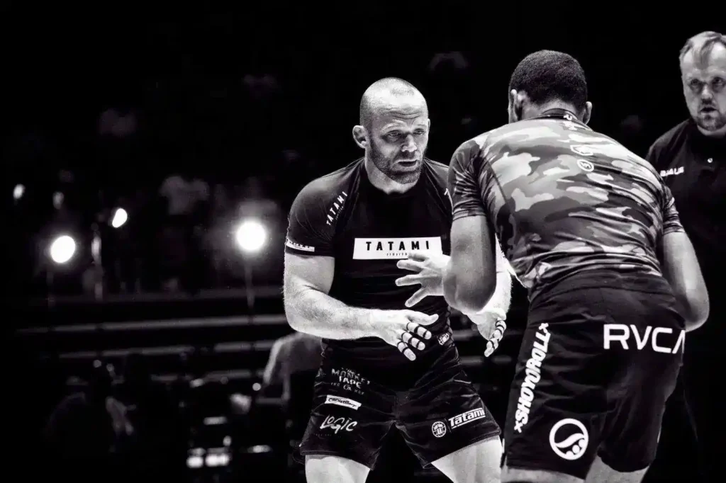 No-gi grapplers in rash guards and grappling shorts competing at ADCC