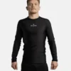 Man wearing a Progress Academy long sleeve rash guard