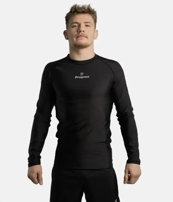 Man wearing a Progress Academy long sleeve rash guard