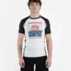 A model wearing the 'Progress Unknown Great Wave Rash Guard.'