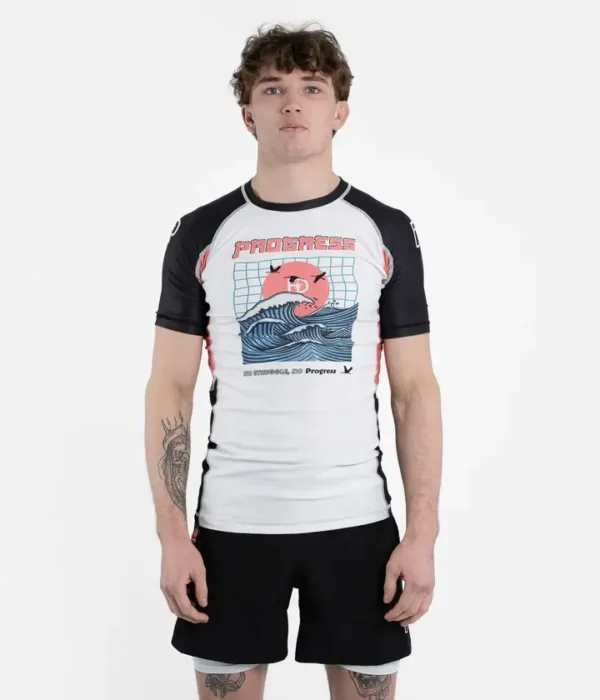A model wearing the 'Progress Unknown Great Wave Rash Guard.'