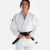 Woman wearing Progress Women's Academy BJJ Gi with a free white belt