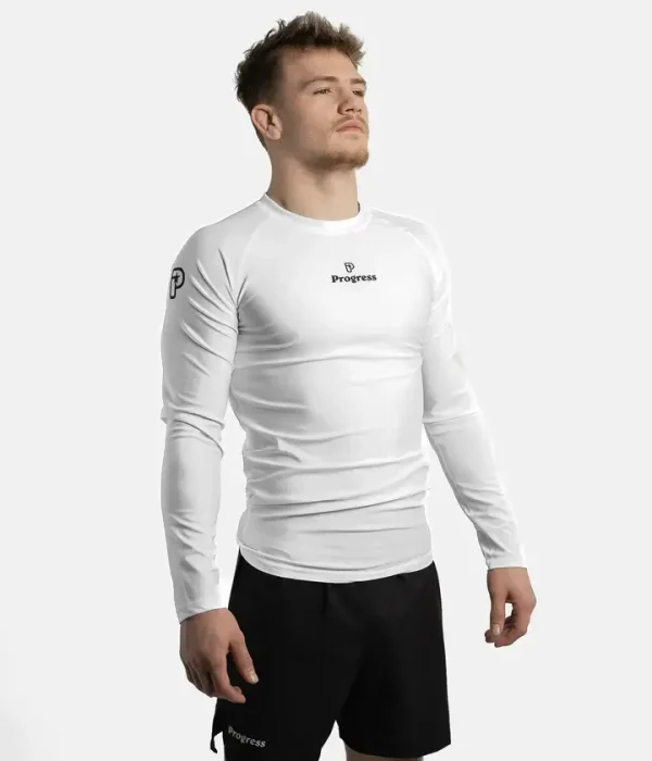 Progress Academy Rash Guard Long Sleeve White 1 Person wearing Progress Academy long sleeve rash guard