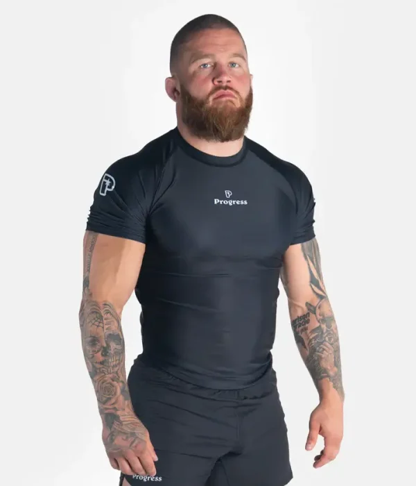 Male athlete wearing the Progress Academy short sleeve rash guard