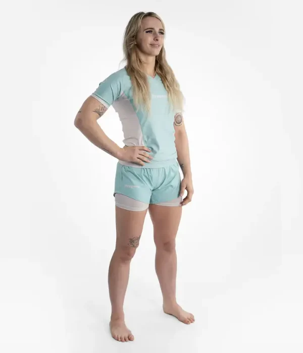 Woman wearing a Progress Academy's women's rash guard