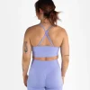 Woman modeling the Progress Eira Ladies Seamless Sports Bra in a gym setting