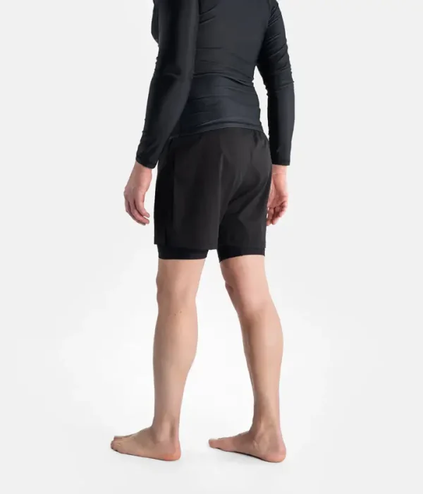Man wearing Progress Flex Hybrid Shorts