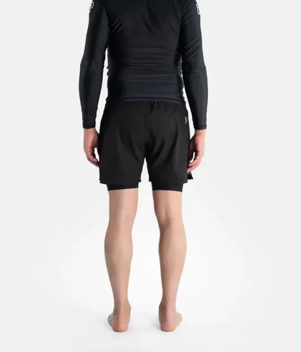 Man wearing Progress Flex Hybrid Shorts