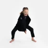 Child wearing Progress Kids Academy BJJ Gi with free white belt.