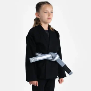 Child wearing a Progress Kids Academy BJJ Gi with a free white belt