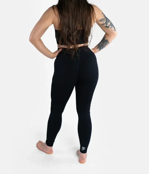 A woman wearing the Progress Ladies Pro Seamless Grappling Leggings