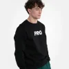 Man wearing a light grey Progress PRG Crewneck Sweater