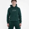 Youthful model wearing a Progress PRG black hoodie