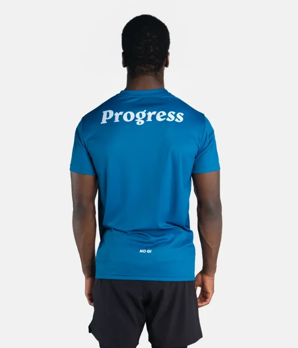 Man displaying a Progress Rolling band T-shirt