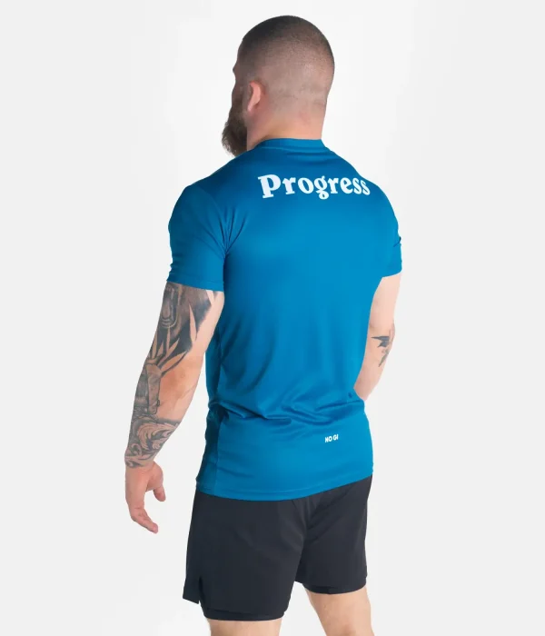 A man wearing a Progress Rolling Tee