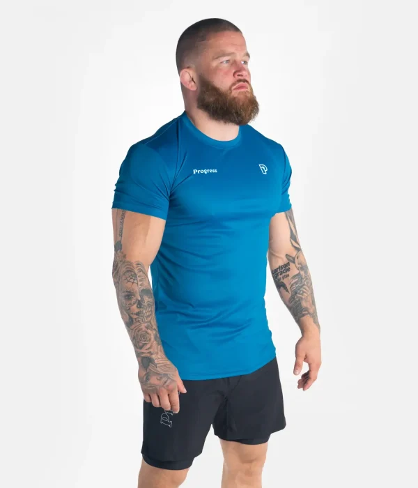 Golfer in mid-swing wearing the Progress Rolling Tee