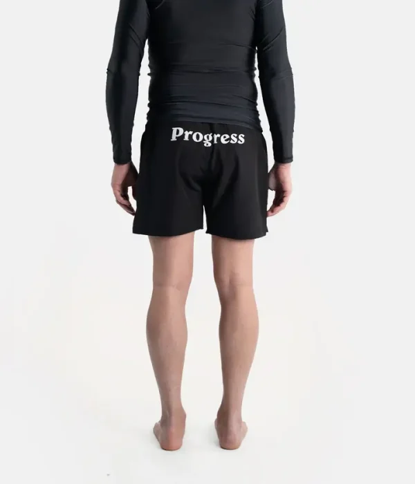 Man wearing Progress Vasco Board Shorts