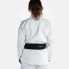 Woman wearing Progress Women's Academy BJJ Gi with a free white belt