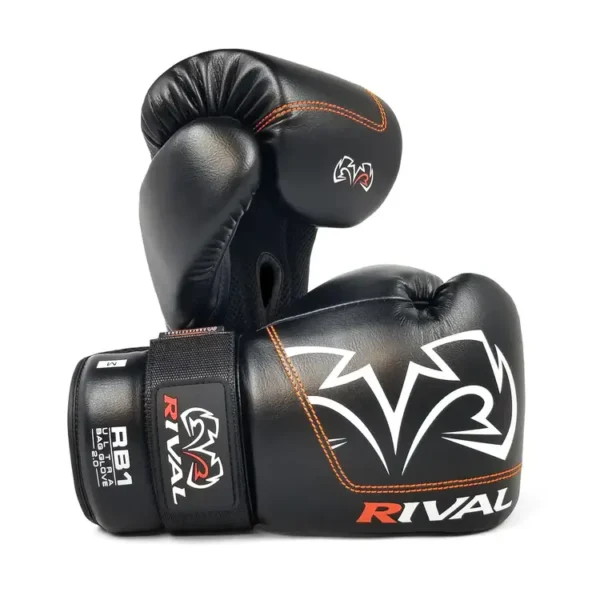 Rival Boxing Bag Gloves RB1 Ultra 2.0 in black and gold color.