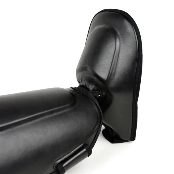 Pair of Fairtex SP8 Ultimate Shin Guards on white background