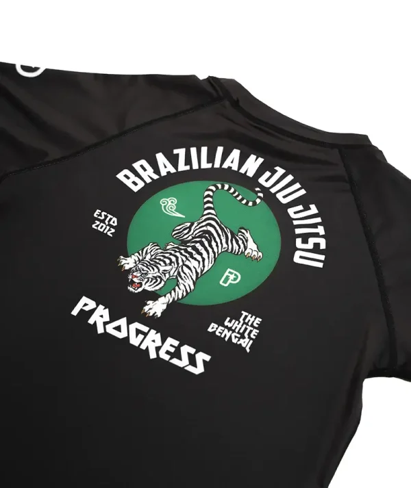 Child in a vibrant Progress Bengal Rash Guard designed for kids