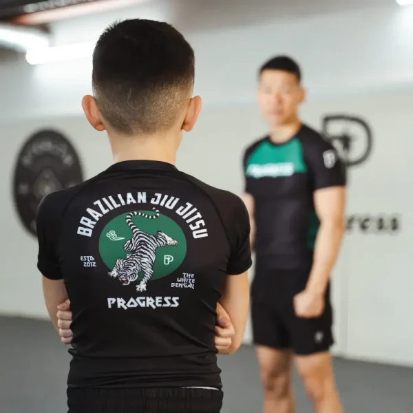 Young child wearing Progress Kids Bengal Rash Guard
