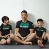 Kid wearing Progress Kids Bengal Rash Guard