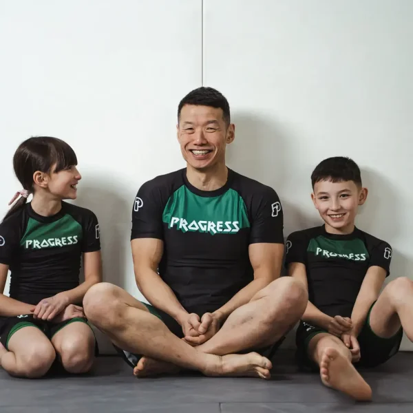 Kid wearing Progress Kids Bengal Rash Guard