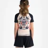 Little boy wearing a Progress Kids Sugar Skull Rash Guard