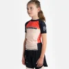 Kid wearing the Progress Kids Sugar Skull Rash Guard