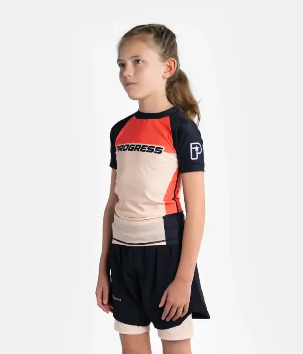 Kid wearing the Progress Kids Sugar Skull Rash Guard