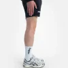 Two white and black Progress PRO socks on a neutral background