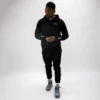 Man wearing a Rival Track Jacket with a hood