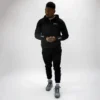 Male model showcasing Rival Track Pants