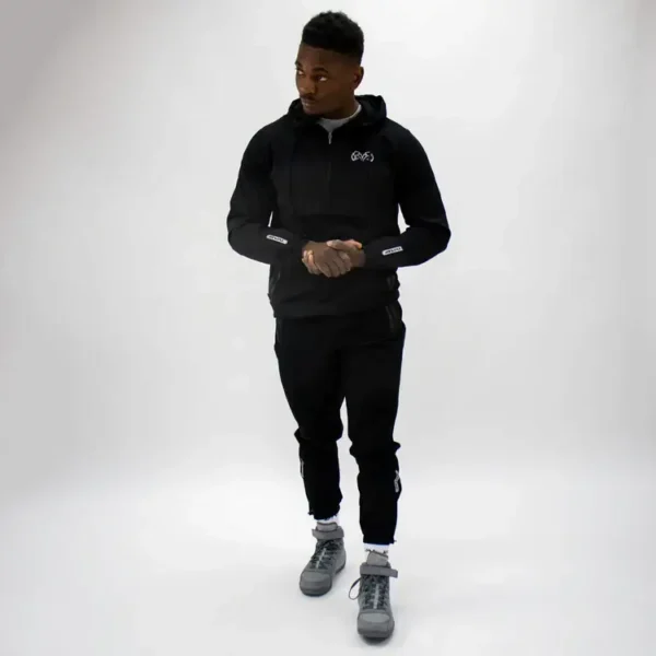 Male model showcasing Rival Track Pants