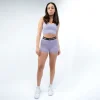 Woman wearing a Rival Buttery Stretch Cross-Back Sports Bra in a gym setting