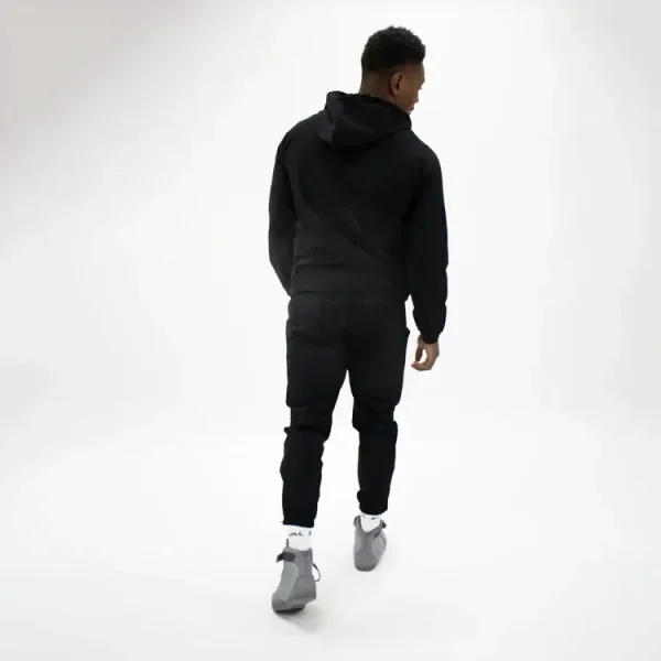 Model sporting black Rival Track Pants