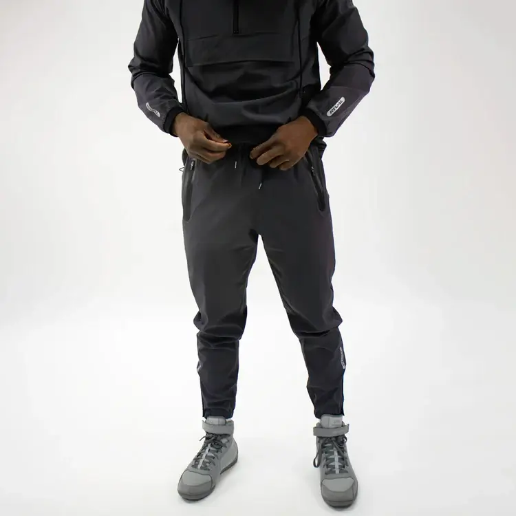Blue and white Rival track pants on a white background