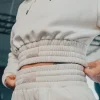 Woman wearing Rival Cropped Heavyweight Fleece Hoodie in a casual setup