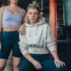 Woman wearing a Rival Women's Cropped Heavyweight Fleece Hoodie