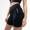 Woman modeling Rival Women's High-Rise Biker Shorts with pockets