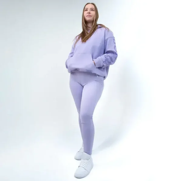 Rival Womens Oversized Heavyweight Fleece Hoodie Lavender 1 Woman wearing a Rival Women's Oversized Heavyweight Fleece Hoodie