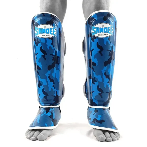 Kid wearing Sandee Camo Boot Shinguards on a football field
