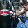 Sandee Punch Bag Full Leather Black 1 Sandee Full Leather Punch Bag gleaming under studio lights