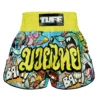 A young athlete wearing TUFF Kids Muay Thai Shorts Ready To Rumble RMS106