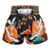 A person wearing TUFF Muay Thai Shorts Autumn Sunray MS652
