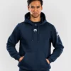 Venum x UFC Fusion Pullover Solid Hoodie Man wearing Venum x UFC Fusion Men's Fight Week Pullover Solid Hoodie