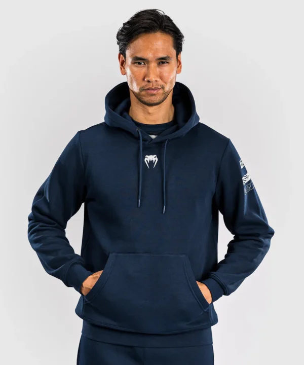 Venum x UFC Fusion Pullover Solid Hoodie Man wearing Venum x UFC Fusion Men's Fight Week Pullover Solid Hoodie