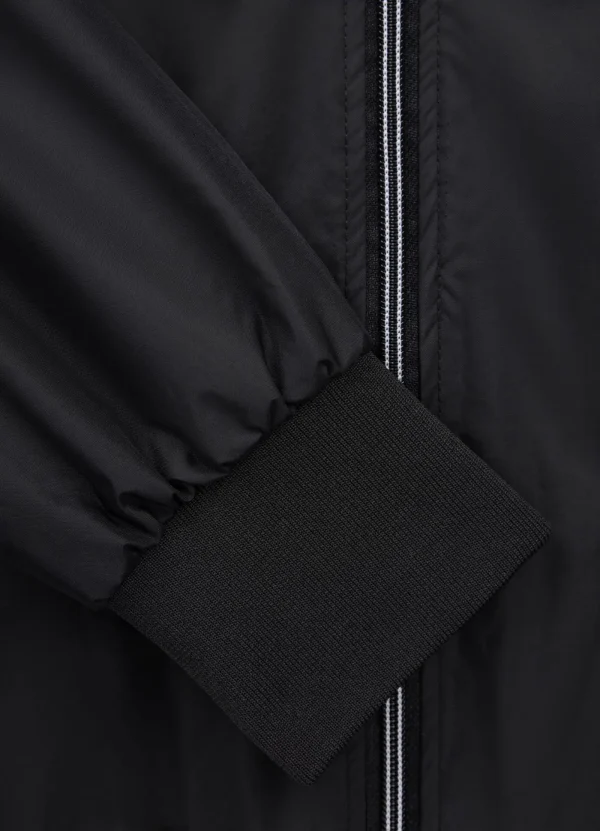 Pitbull Sports Official ADCC Nylon Jacket in a sporty setting