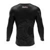 Rashtag Tidal Waves Rash Guard Black 1 Man wearing RashTag Tidal Waves Rash Guard on a background of the sea